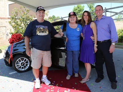 Photo Credit: Pitter Goughnour; Mary Arthur of Eatonton (center) is congratulated by friend Ronnie Hamm (left) and Drs. Patti and David Bradley (right) after being announced winner of the Lake Oconee Dentistry FIAT giveaway. 