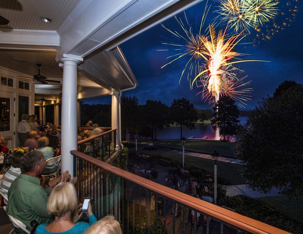 Reynolds Plantation members watch the fireworks over Lake Oconee from the Great Waters Clubhouse.