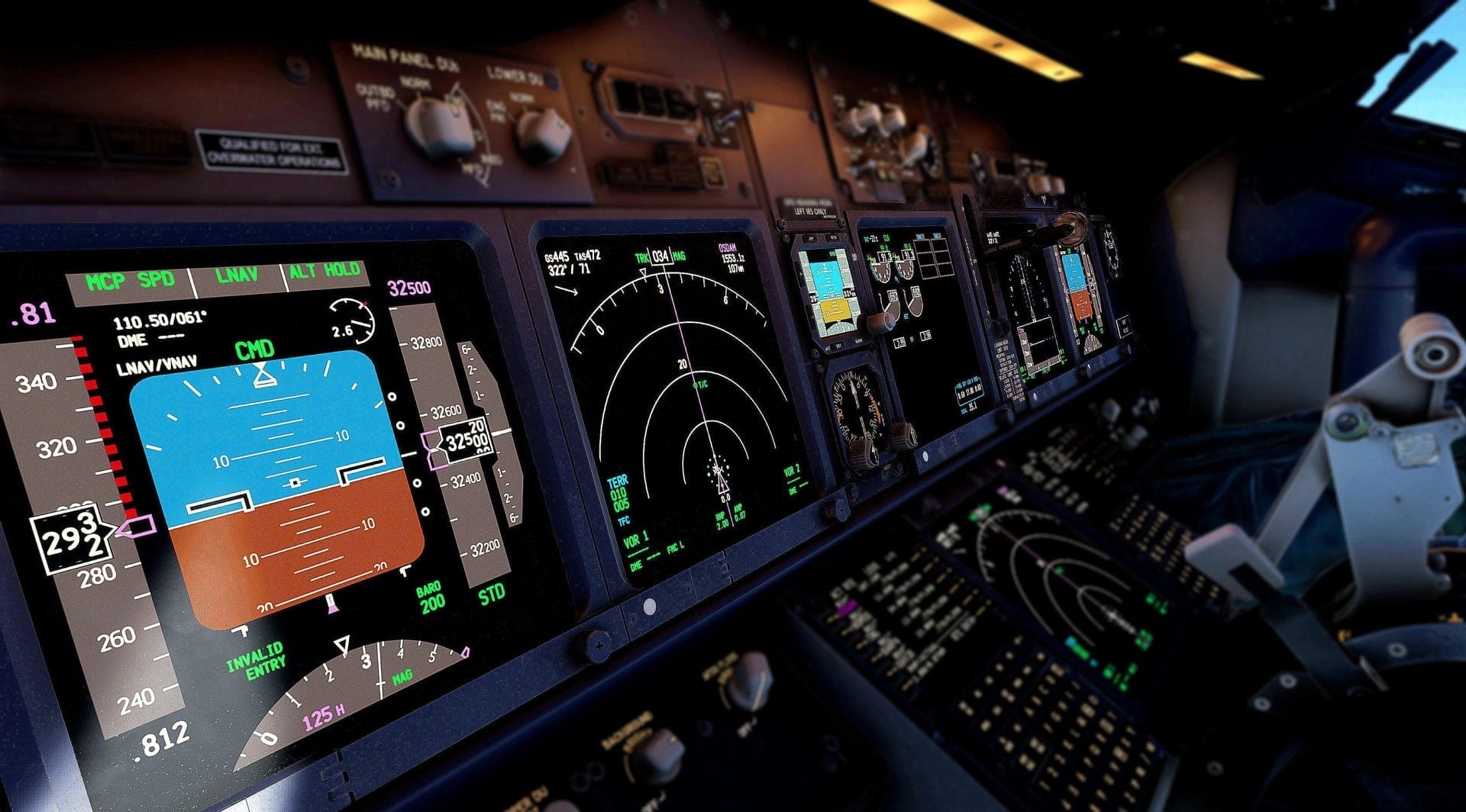 The electronic system in the cockpit of an aircraft. There are buttons and screens displaying flight paths and radars.